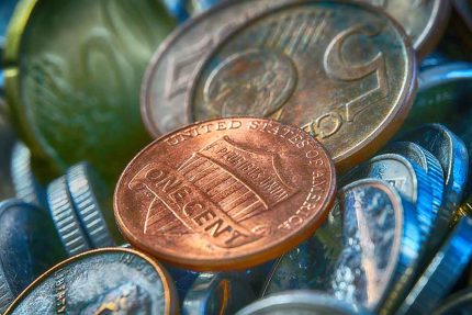 Macro Shot of One Cent Coin Amongst European Money Stock Image